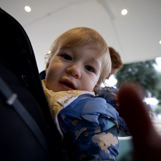 Toddler's Curious Gaze at Family Restaurant
