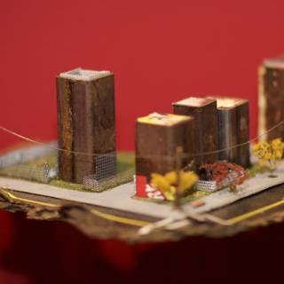 Miniature Cityscape on a Table, Adorned with Sweet Treats and Floral Imageries