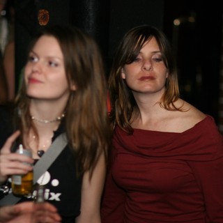 Two Women at a Dimly Lit Evening Event 2006
