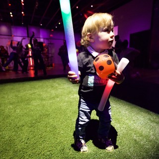 Young Child at Baby Rave Light-Up Event