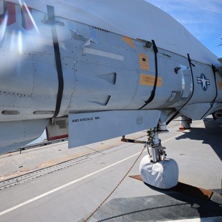 Close-Up of Vintage Military Aircraft Landing Gear and Fuselage