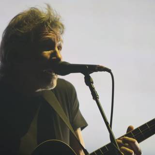 Roger Waters Rocks the Stage with His Guitar and Mic