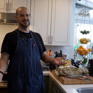 Home Chef Preparing Christmas Eve Dinner in Modern Kitchen