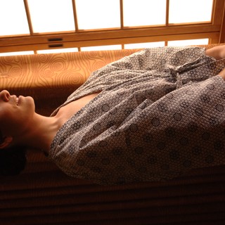 Bride in Robe Gazing Thoughtfully Through Morning Window