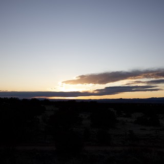 Dramatic Sunset Over Desert Landscape at Twilight