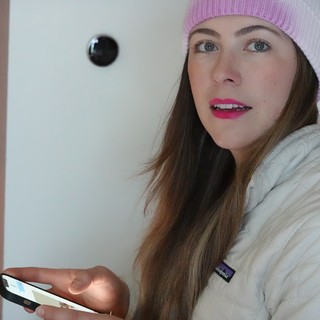 Woman with Pink Beanie Using Smartphone Indoors