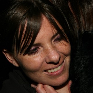 Joyful Woman Smiling During Warm Embrace