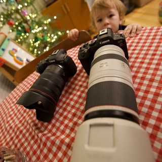 Young Child with Professional Canon Cameras at Christmas
