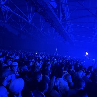 Blue-Lit Crowd at Electronic Music Concert