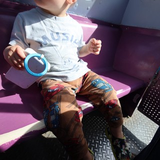 Toddler Enjoying a Sunny Ride at Fantasyland