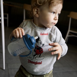 Toddler with Baby Bottle in Disneyland Sweatshirt