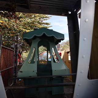 Pagoda Ride Structure Framed Through Metal Doorway