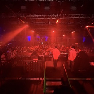 Electronic Music Performance with Red Stage Lighting