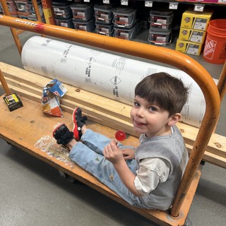 Young Boy's Hardware Store Cart Adventure