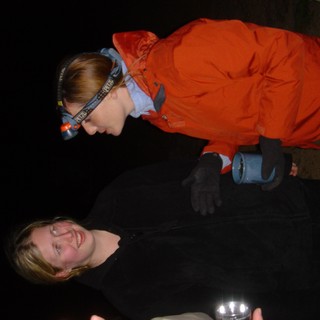 Cave Explorers Share a Laugh in the Dark
