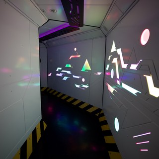 Futuristic Sci-Fi Corridor with Geometric Light Projections