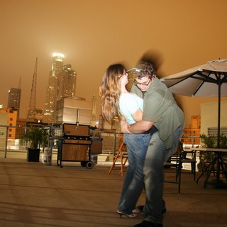 Rooftop Romance Under an Orange Night Sky