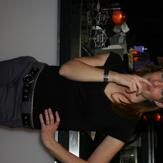 Woman Poses Thoughtfully at New Year's Eve Bar