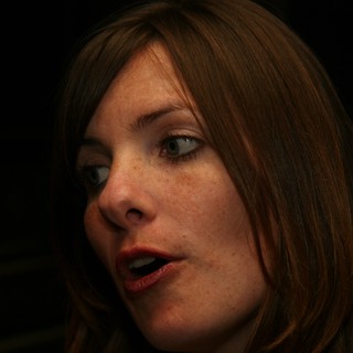 Penelope Speaking Candidly in Dramatic Low Light