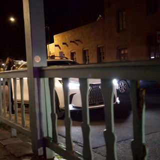 Night View Through Turquoise Railing in Santa Fe