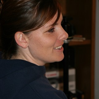 Candid Profile Portrait of Smiling Woman Indoors