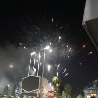 Fireworks illuminate the night sky over baseball stadium
