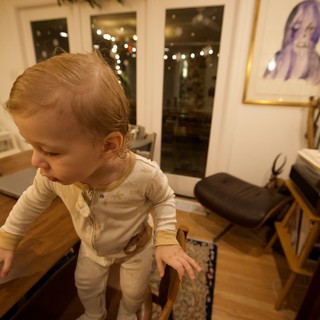 Toddler Exploring Cozy Living Room at Night