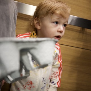 Curious Toddler in Mickey Mouse Pajamas at Home