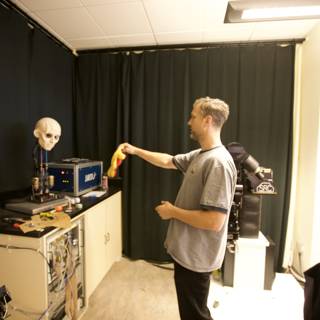 Holding Yellow Object in Workshop