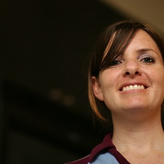 Candid Portrait of a Smiling Woman Looking Up