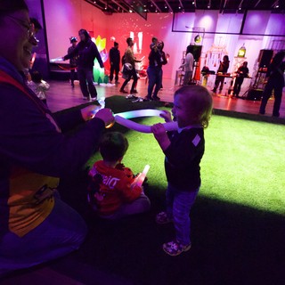 Children Enjoying Interactive Light Installation at Baby Rave
