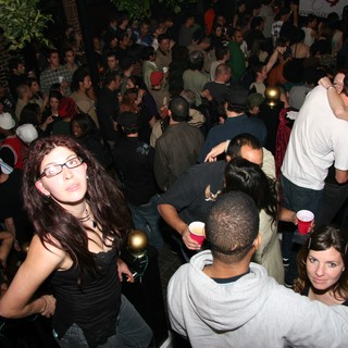 Crowded Indoor Party Scene on Christmas Eve 2005