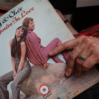 Vintage Record Album Being Displayed by Hand