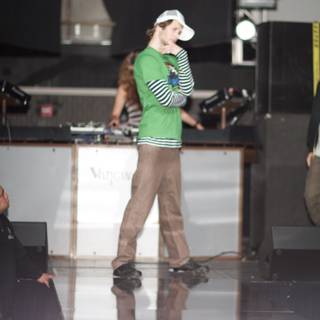 Green Shirt and White Hat on the Music Stage