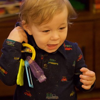 Toddler Playing with Toy Keys at Christmas