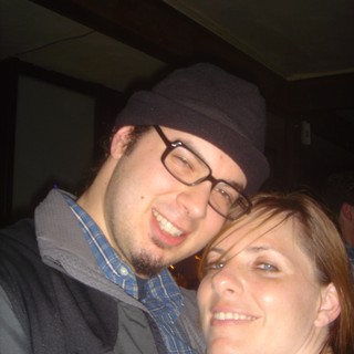 Dave and Penelope Smiling Together at Indoor Venue