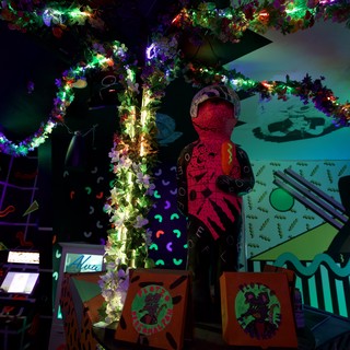Vibrant 90s-Style Neon Restaurant Interior with Festive Decorations