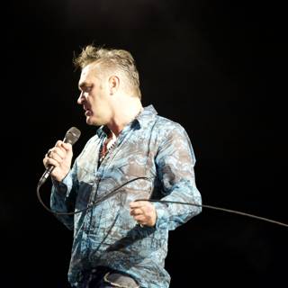 Blue Shirted Man Belts Out Tunes with Mic at Coachella