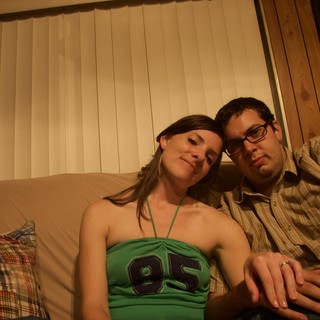 Couple Relaxing Together on Couch at Home