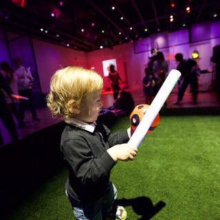 Child with Light Sword at Baby Rave Event