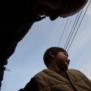 Low Angle Portrait of Person in Brown Jacket
