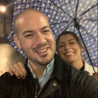Smiling Couple Captures Moment with Umbrella Selfie