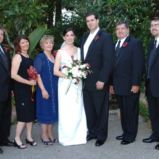 Family Wedding Portrait in Lush Garden Setting