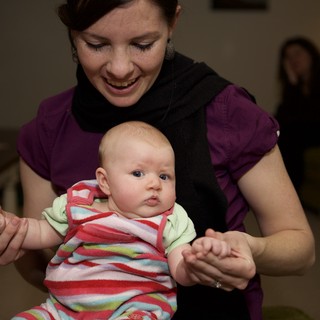 Mother and Baby Share a Joyful Moment Indoors
