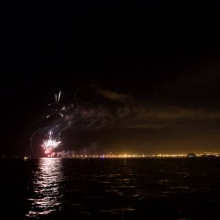 Spectacular Fireworks Display Over the Lake at Night
