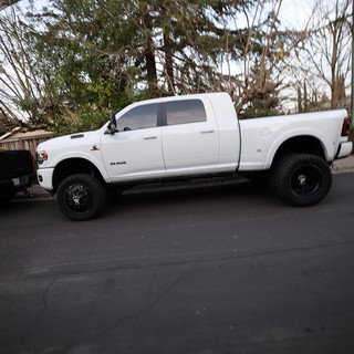 Lifted White Ram Truck on Suburban Street