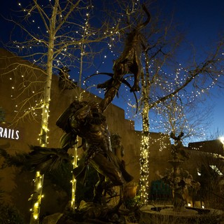 Illuminated Bronze Statue at Twilight in Santa Fe