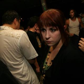 Red-Haired Woman in a Club Crowd