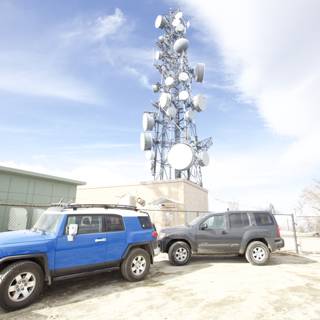 SUVs Parked by the Cell Tower