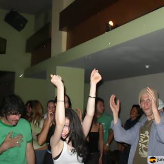 Night Club Partygoers Throw Their Hands Up